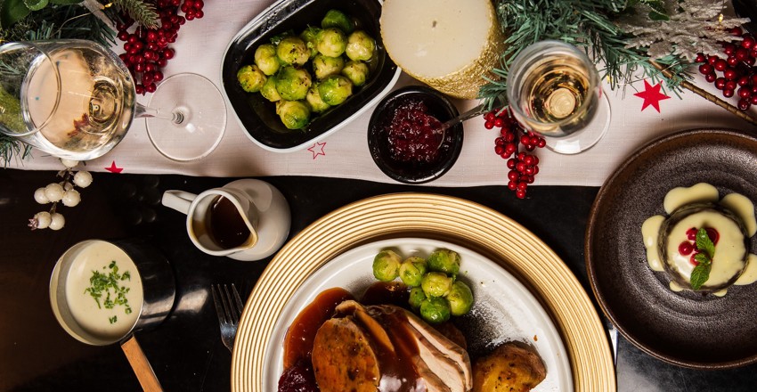 Christmas spread with roast turkey, Christmas pudding and