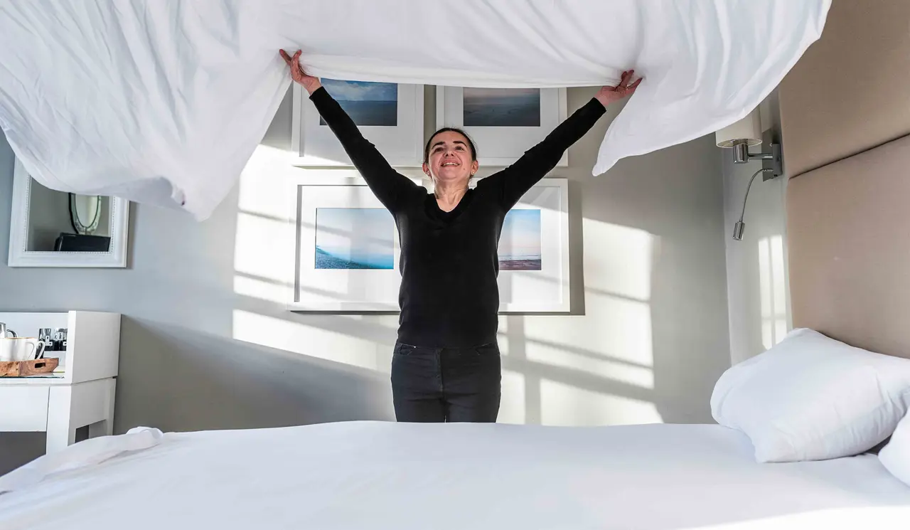 Crown at Woodbridge, Folk making bed with sheet
