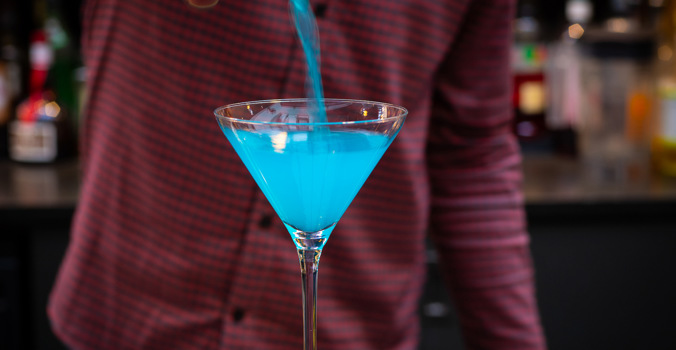 Blue cocktail being poured - The Crown at Woodbridge